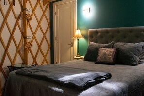 The cozy queen bed invites you to fall asleep to the sound of the river.