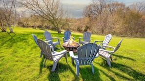 Gather around the firepit in the backyard.