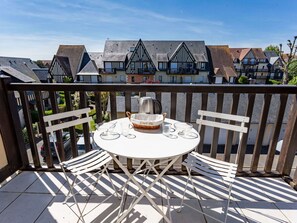 Sky, Building, Table, Window, Outdoor Furniture, Urban Design, Wood, Shade, Condominium, House