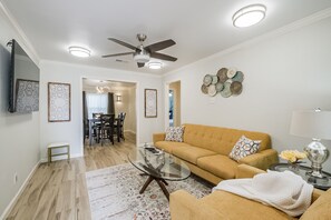 View of living room and dining room from front entrance