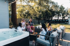 Immerse yourself in an unparalleled outdoor experience with our inviting outdoor seating area conveniently located near the hot tub and outdoor kitchen.