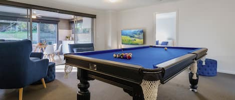 Game room with pool table, smart TV