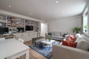 Sink into the plush sofa, offering a cozy spot to relax and unwind after a long day of adventures.