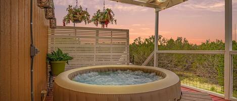 The bubbling and soothing hot tub seats four, and presents a ringside seat for inspiring Hill Country views.