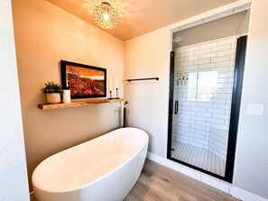 Beautiful separate soaking tub in the main bathroom 