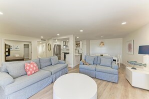 Living room facing the kitchen and dining room