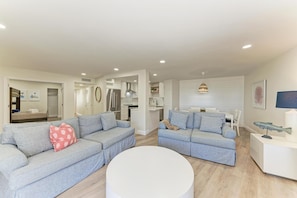 Living room facing the kitchen and dining room