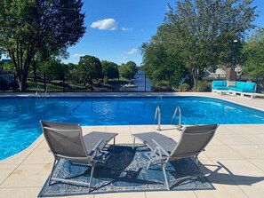 Sun chaises looking out onto private pool and onto the lake & dock