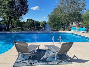 Sun chaises looking out onto private pool and onto the lake & dock