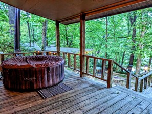 Enjoy a dip in the hot tub overlooking the cove.