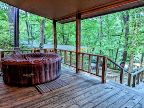 Enjoy a dip in the hot tub overlooking the cove.