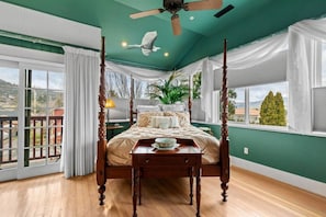 Queen bedroom with balcony and wrap around windows