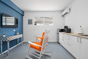 Living room with comfy rocking chair for relaxing evenings.