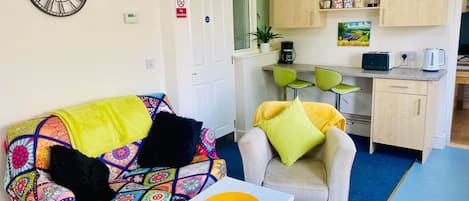 Lounge/Kitchen area, complete with breakfast bar.
