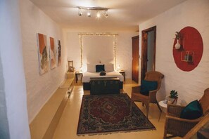 The romantically lit, bedroom for 2. 100% cotton linen, reading nook and closet complete this cozy, Cave like space. 