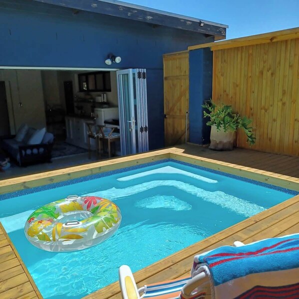 The private deck and plunge pool area is perfect for those sunny days!! The pool is semi heated with solar tube panels. 
