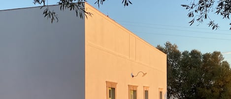 The villa's facade at sundown
