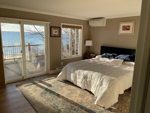 Master bedroom upstairs with King bed and separate walk out doors to deck 