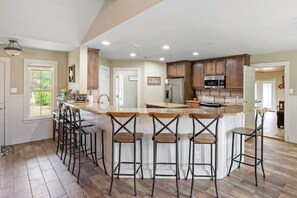 Bar with 7 barstools.