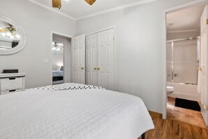 Black and white room with private bath.