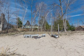 Sandy beach with fire ring