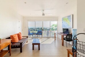 Living room with shades open.