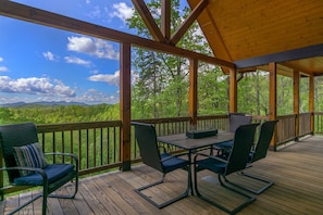 Dine al fresco on the covered deck while looking out at the gorgeous mountain views.