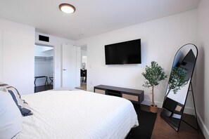 Our master bedroom with a King size bed, smart TV & private bathroom.