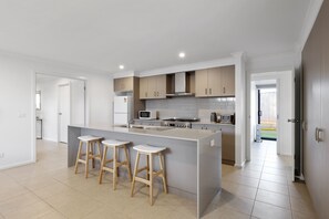 Spacious kitchen with breakfast bar