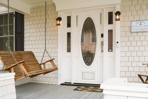 Welcome home through the elegant front door: a stylish entry point that sets the tone for the comfort awaiting inside Charlotte House