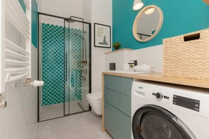 The bathroom's contemporary decor complements the apartment's style. 