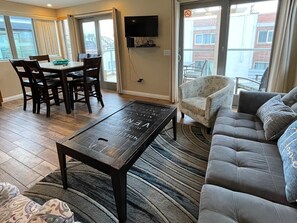 Living Area and Dining Table all in one room. Kitchen is next to Dining Table