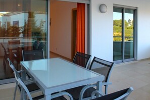  Balcony with outdoor furniture with table and chairs