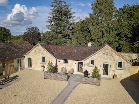 Cosy 1 bed unit converted piggery. Patio with chairs and Charcoal BBQ