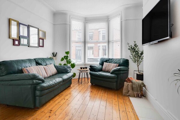 Comfortable Living Space featuring:
- Comfortable seating and sofa bed
- Smart TV with Netflix
- Board games
