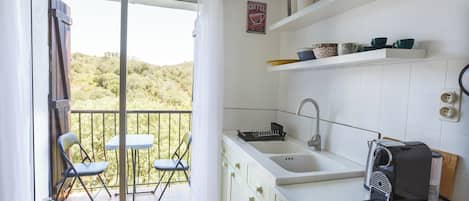 Kitchenette and Balcony with River and Vineyard Views