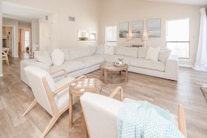 Spacious and bright living room with seating for all 8 guests!