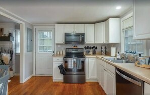 Open kitchen with most cooking supplies for a feast! 