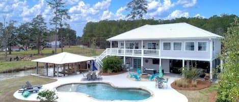 Two story lakefront house with pool and two private boat docks with lifts