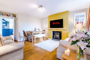 Spacious living/ dining room with sofa bed