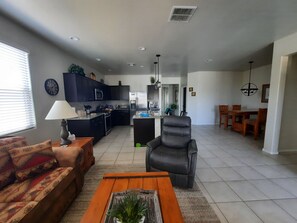 Open floor plan, roomy kitchen with an island sink, and fully equipped kitchen. 