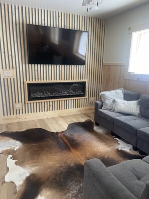 Living Room with electronic Fireplace you can set for any mood.  TV and WiFi
