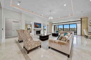 Main floor living room, upholstered sofas and sectionals, in-ceiling sound