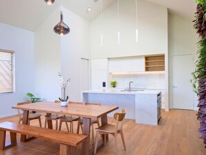 the modern kitchen and dining area