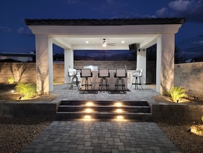 Outdoor kitchen with large Island and TV