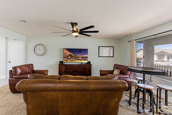 Comfortable sectional seating with Smart TV - Direct TV + login to your own streaming apps!