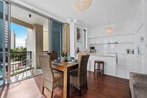 Dining area is right next to the balcony and the kitchen