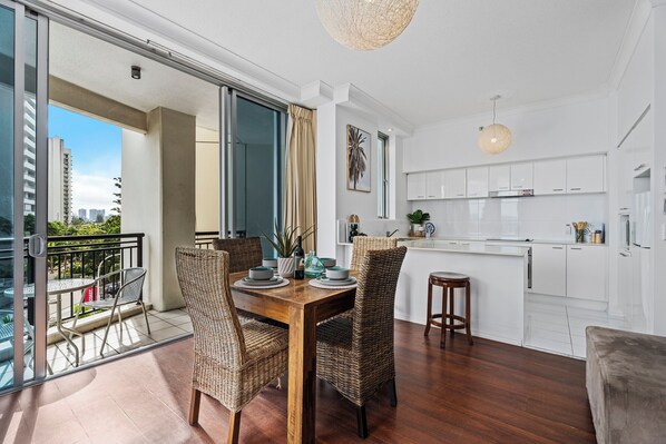 Dining area is right next to the balcony and the kitchen
