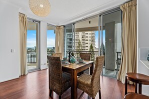 Dining area is right next to the balcony overlooking the city