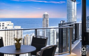 Balcony features glittering ocean and city views